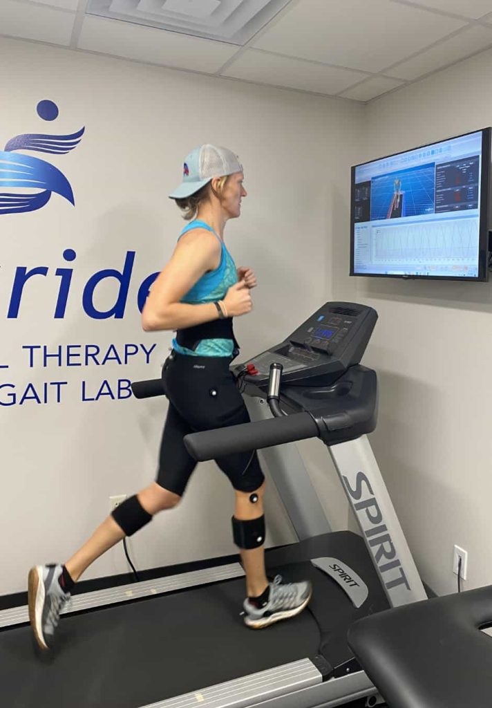 Female runner running on a 3D Gait analysis treadmill in the Twin Cities