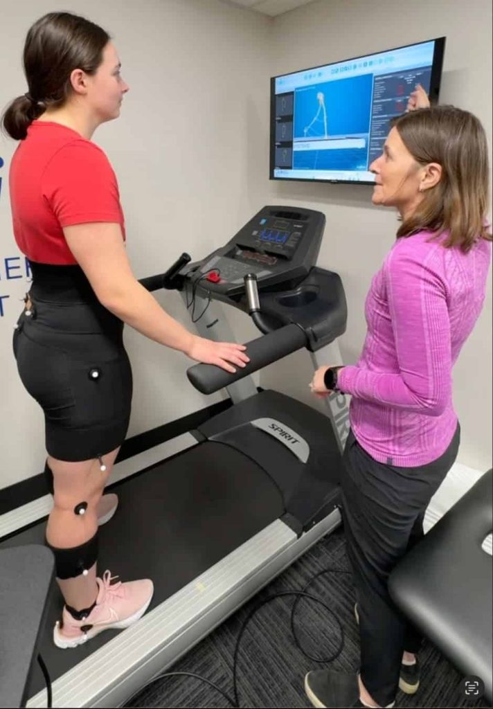 Kristin Gerlach, a Physical therapist in the Twin Cities, evaluating a 3D Gait analysis for a woman runner.